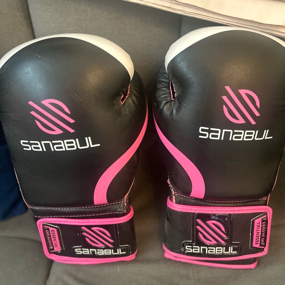 Black and Pink Boxing Gloves with Striking Design
